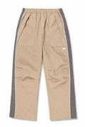 Syna World stone shell track pants with grey mesh side panel and white piping