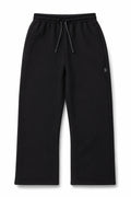 Syna World black heavyweight sweat pants front view with rubber tab detail