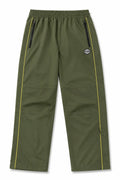 Syna World olive shell track pants with yellow contrast piping and zip pockets